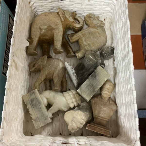 Close-up of a collection of carved onyx animal figurines.