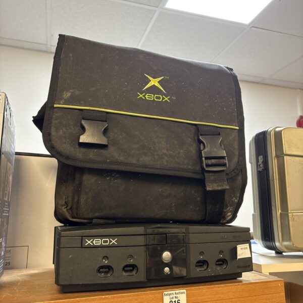 Original Xbox console with carrying bag for retro gaming.