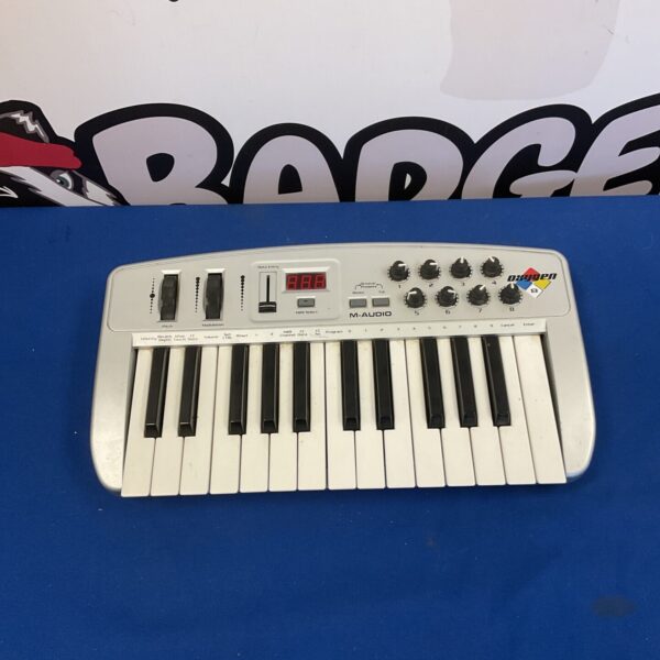 Compact Oxygen 8 MIDI keyboard for music production.