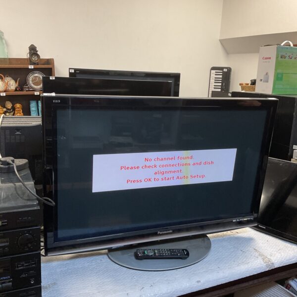 Panasonic TX-P42G15B plasma TV with remote control.