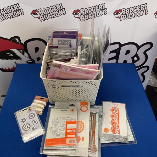 Mixed lot of paper crafting supplies including metal cutting dies and stamps.