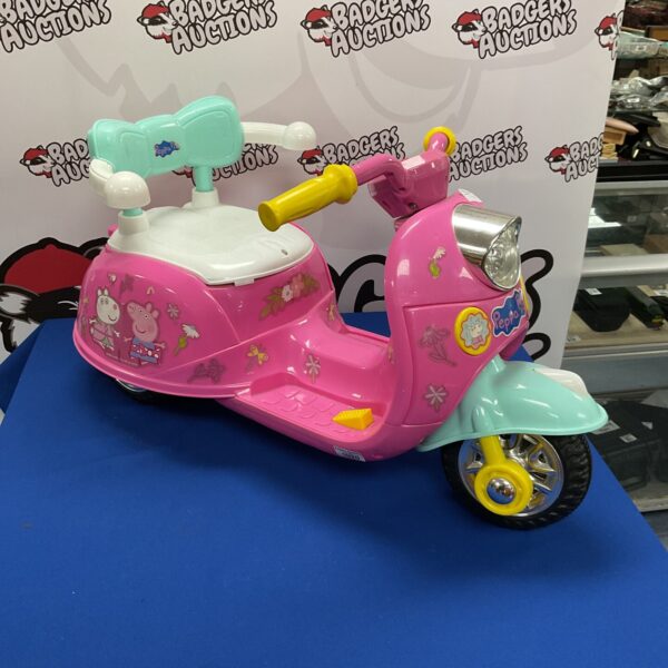 Pink Peppa Pig electric scooter, side view.