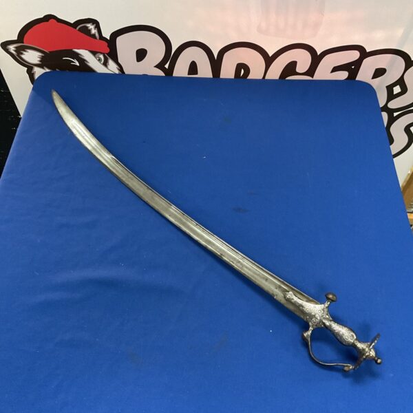 Antique Persian Tulwar sword with detailed silver inlay handle.