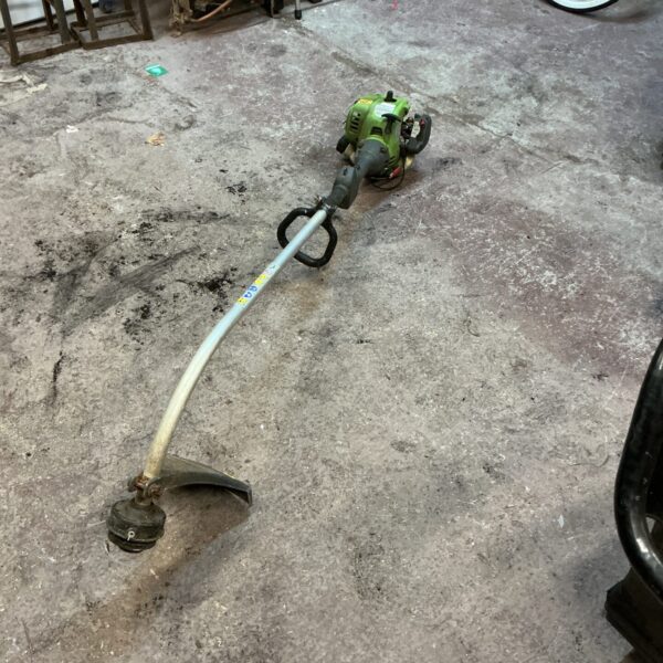 Used petrol strimmer for garden maintenance and landscaping.