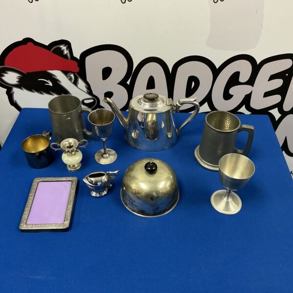 Vintage pewter and silverplate tankards and jug collection.