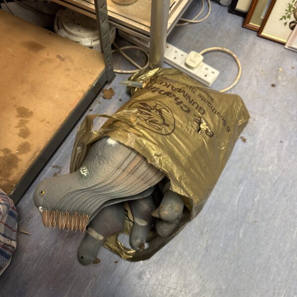 Lot of plastic and rubber pigeon decoys for hunting.