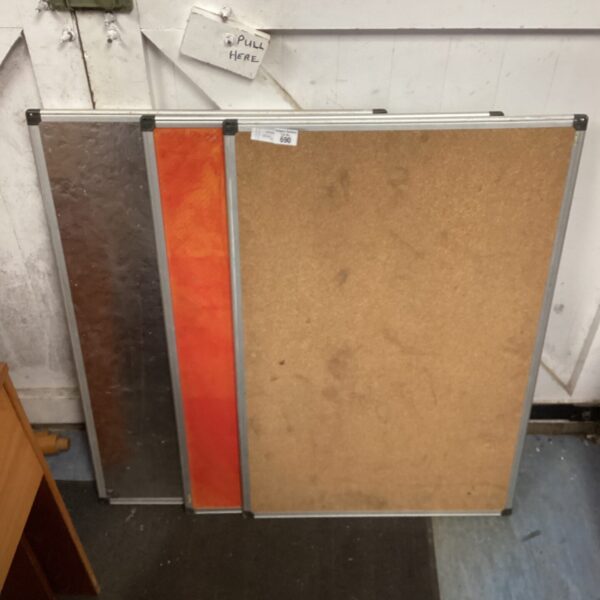 Rectangular cork pin board for notices and photos.