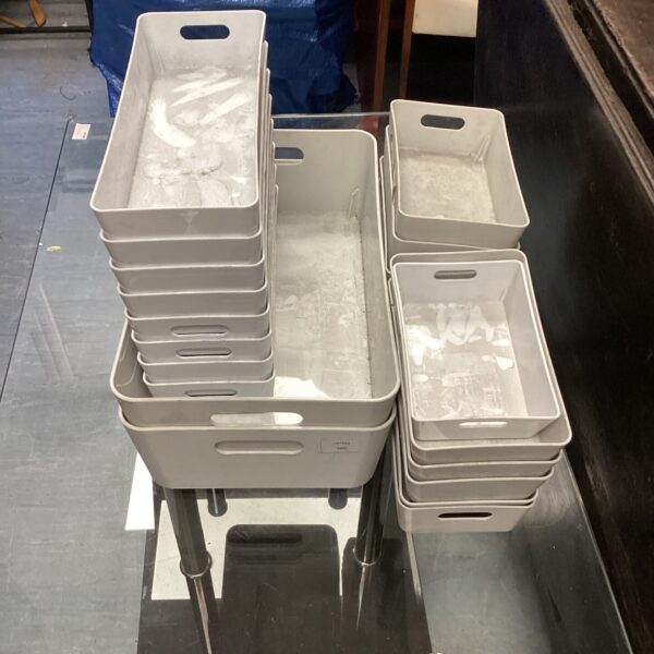 Stack of plastic storage baskets for home organization.