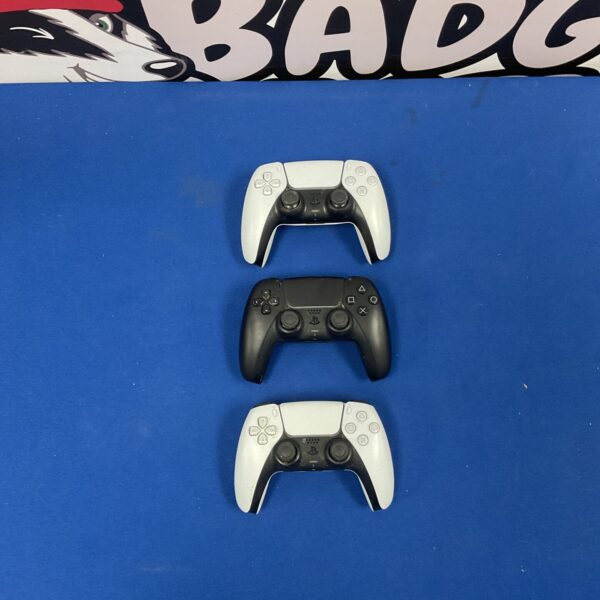Lot of three Sony Playstation 5 controllers for gaming.
