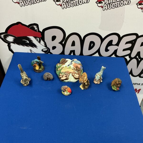 Detailed porcelain bird figurine, vintage collectible sculpture.