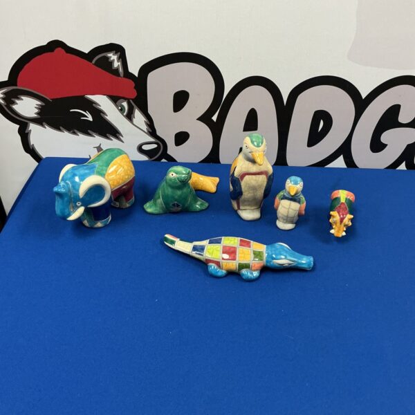 Handmade pottery animal figurines, a charming collectible set.