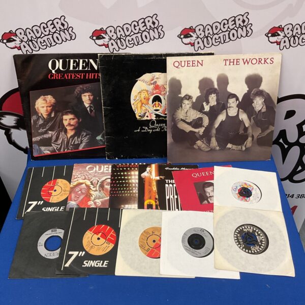 Queen vinyl records and singles collection, including Greatest Hits LP.