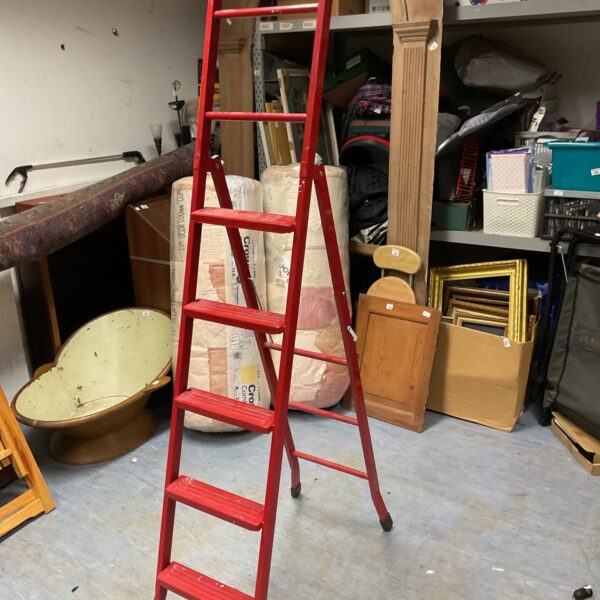 Red aluminium extension ladder for DIY and home use.