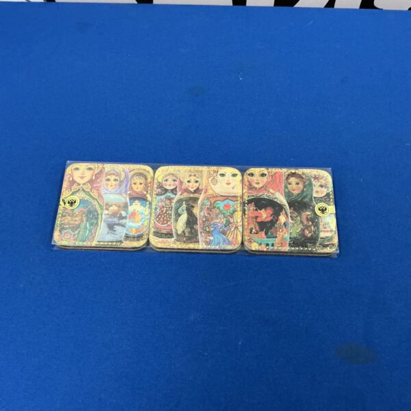 Set of six religious coasters with vibrant icon art.