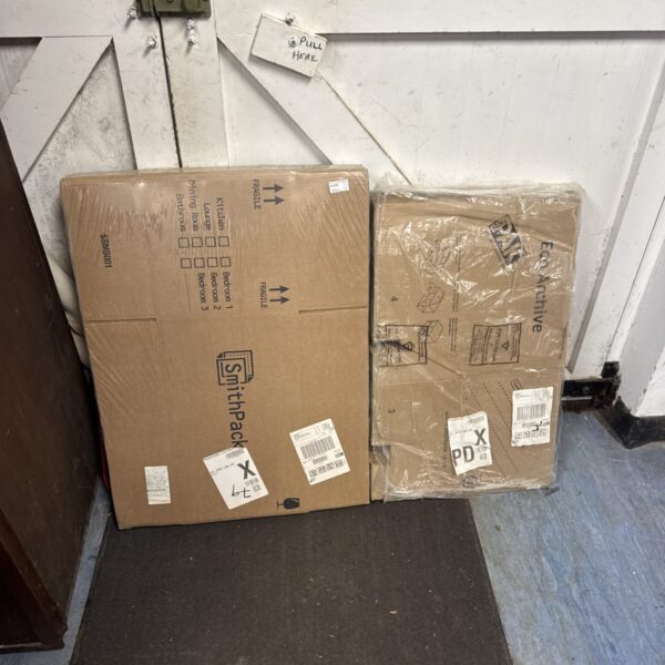Two packs of cardboard removals boxes for house moving and storage.