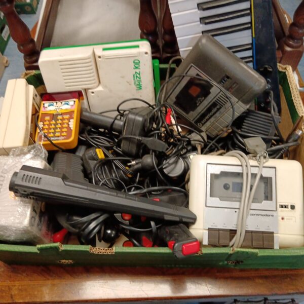 Vintage gaming joysticks and cassette decks lot for collectors.