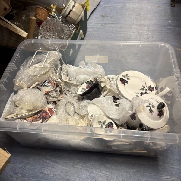 Royal Albert Masquerade china lot in a plastic storage box.