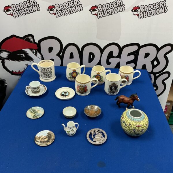 Collection of vintage Royal Commemorative mugs celebrating Queen Elizabeth II.