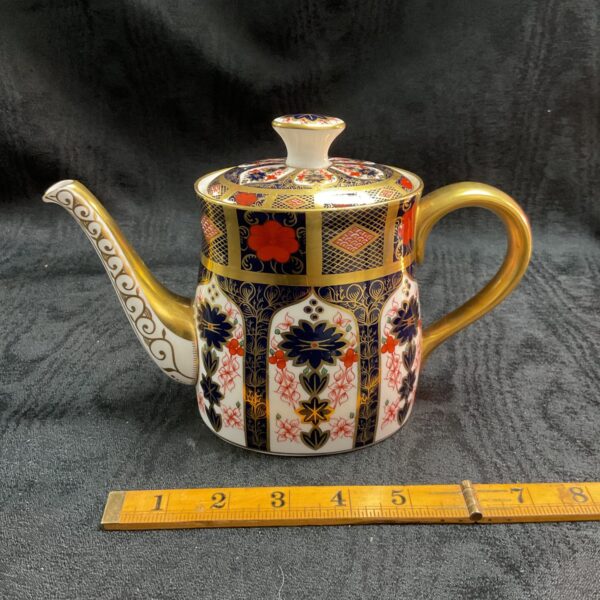 Antique Royal Crown Derby Imari coffee pot with gilded handle.