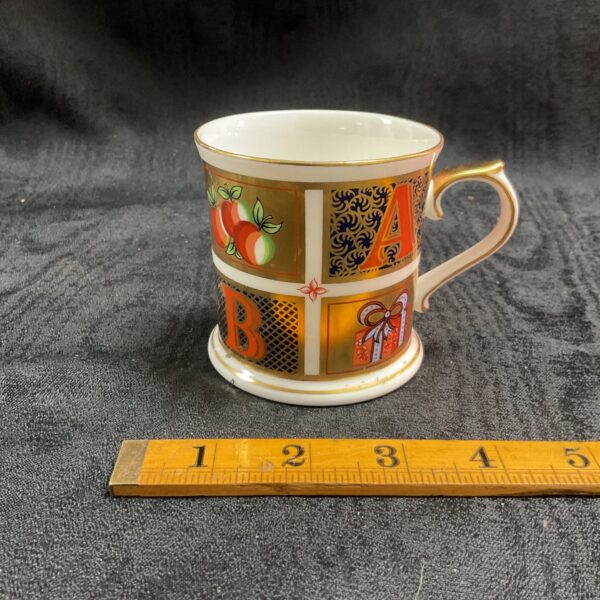 Royal Crown Derby Millenium mug with Imari pattern and vibrant colours.