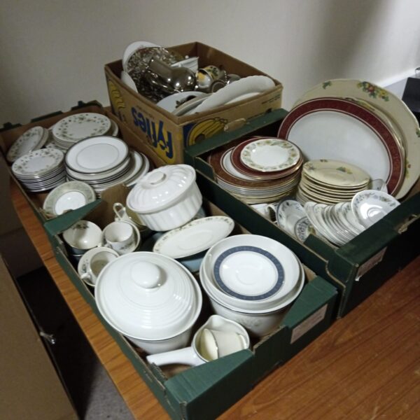 Mixed lot of vintage Royal Doulton china on display.