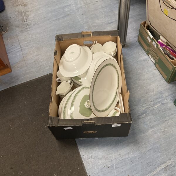 Vintage Royal Doulton tea set with floral pattern on display.
