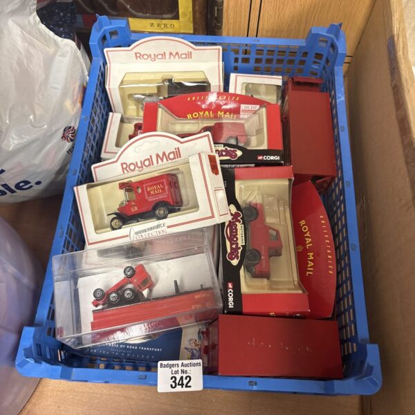 Boxed Royal Mail diecast models by Corgi, collectible postal vehicles.