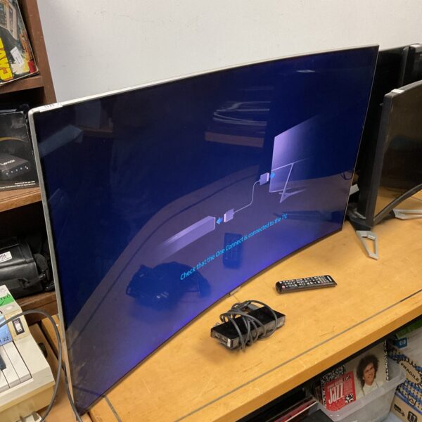Samsung 50 inch curved 4K TV with remote control.