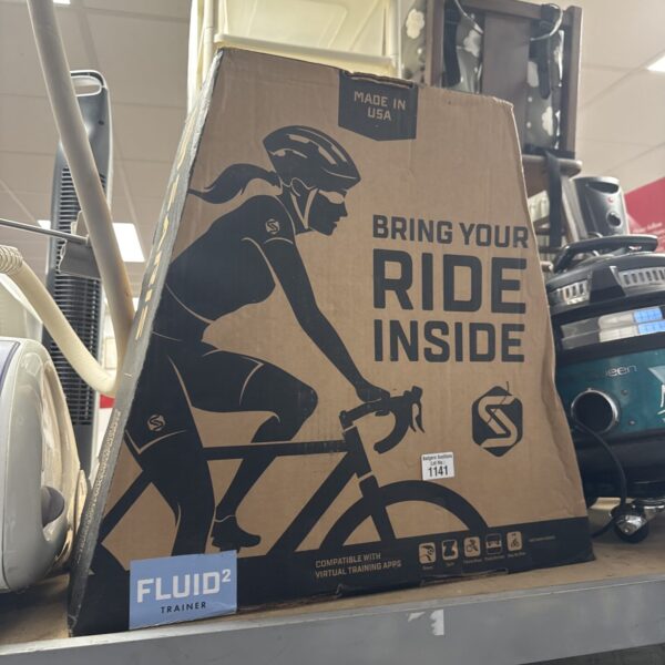 Saris Fluid 2 trainer packaging with cyclist graphic.