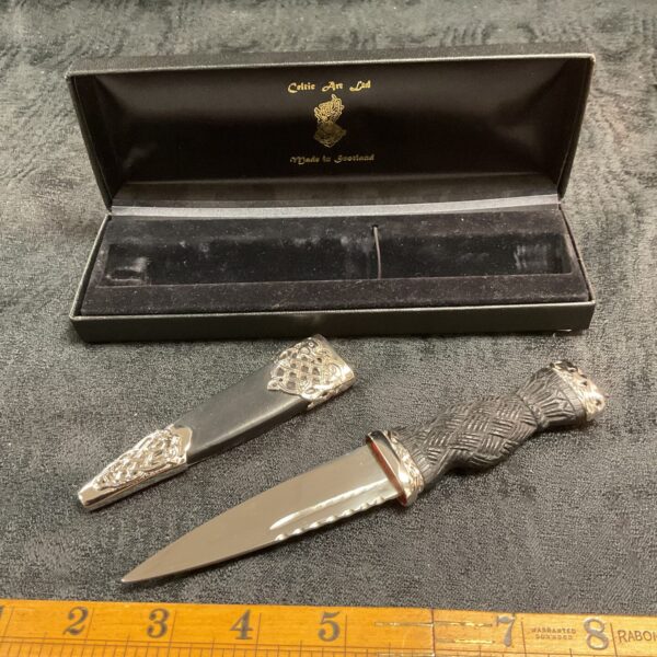 Traditional Scottish sgian dubh with carved horn handle.