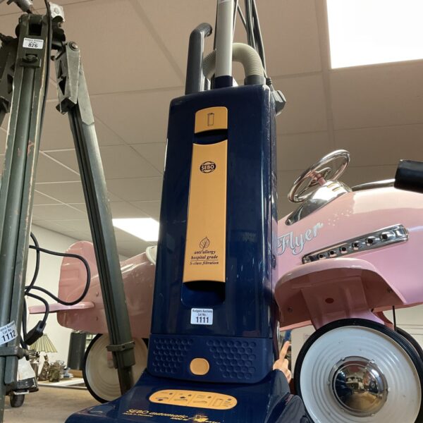 Blue SEBO Automatic X4 upright vacuum cleaner for home floor care.