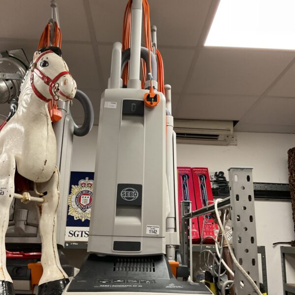 SEBO XP30 commercial upright vacuum cleaner in a commercial setting.