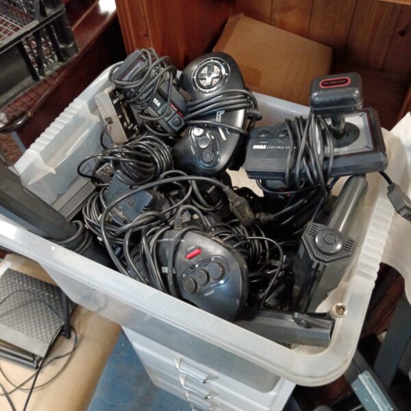 Lot of vintage Sega Mega Drive and Master System controllers and accessories.