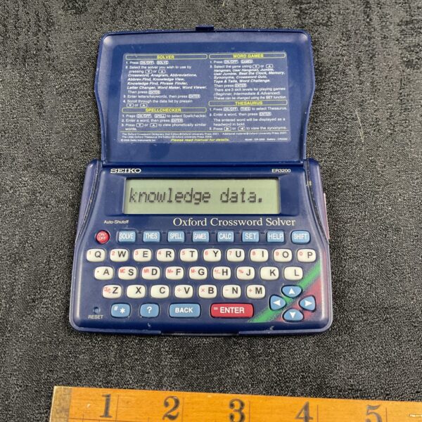 Front view of vintage Seiko Oxford Crossword Solver ER3200 handheld game.