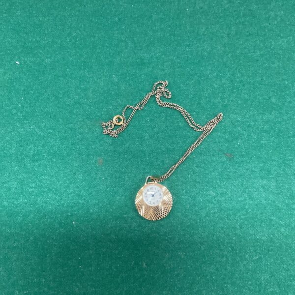 Gold-tone Sekonda pendant watch on a chain.