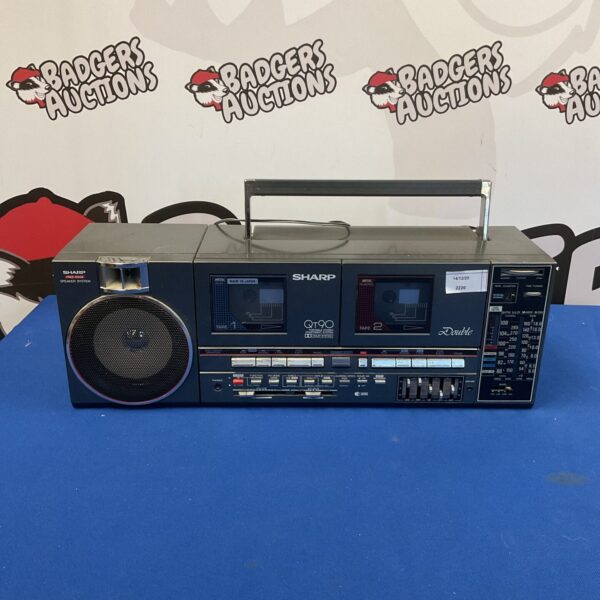 Vintage Sharp portable stereo system with cassette player.