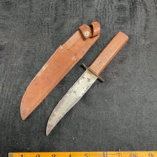 Vintage Sheffield campus knife with leather sheath, collectible item.