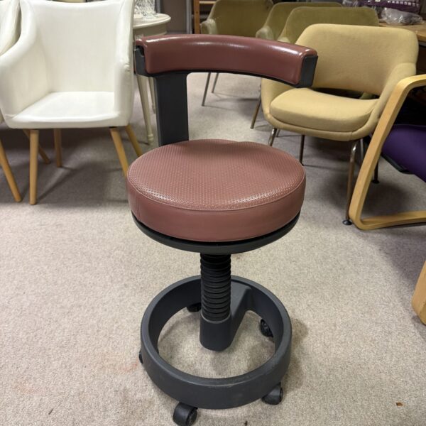 Vintage Siemens Sirona industrial stool with black cushion.