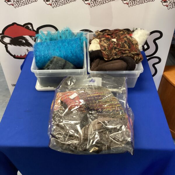 Colourful bundle of silk and cotton scarves for fashion or crafting.