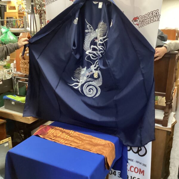 Vibrant silk kimono with a detailed dragon pattern and polyester scarf.