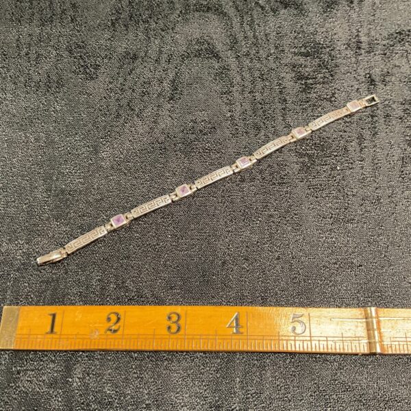 Vintage silver link bracelet with amethyst gemstones.