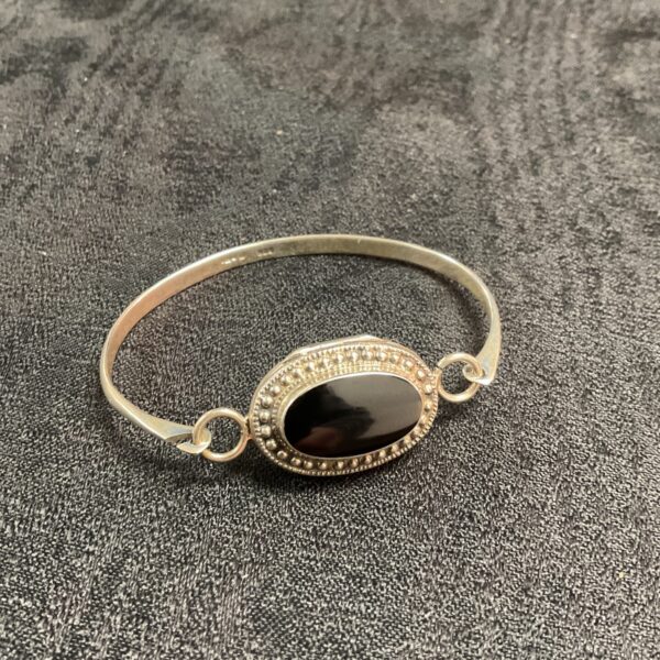 Vintage silver locket bracelet with black onyx stone.