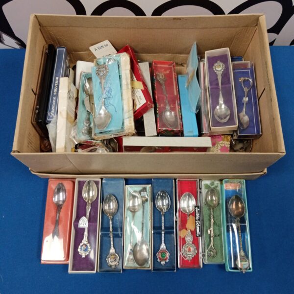 Vintage silver plate collectors spoons in a lot.