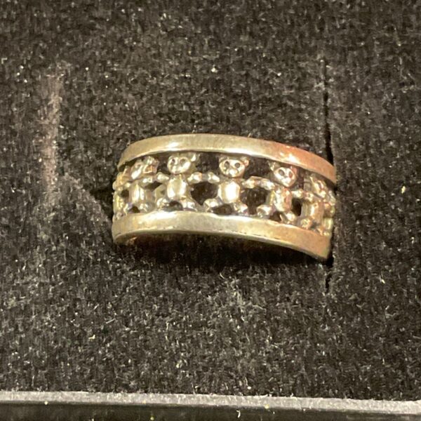 Vintage silver ring with a sculpted teddy bear design.