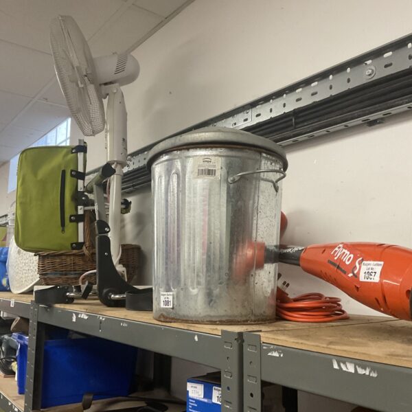 Silver Simpa galvanised waste bin on a shelf.