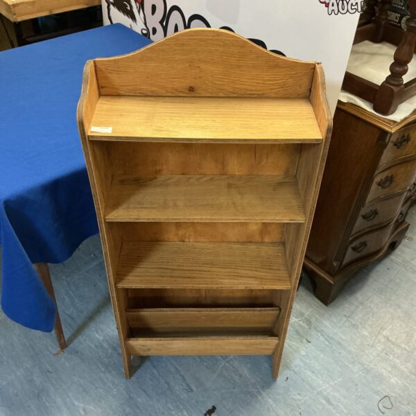 Vintage small wooden bookcase with three shelves.