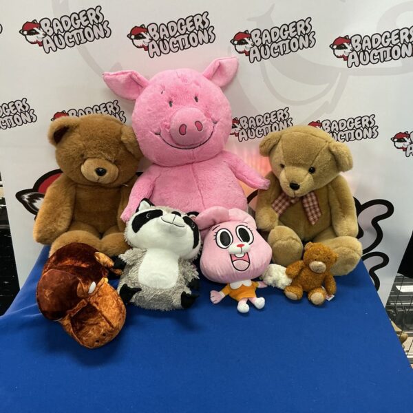 Group of vintage soft toys including a teddy bear and pig.