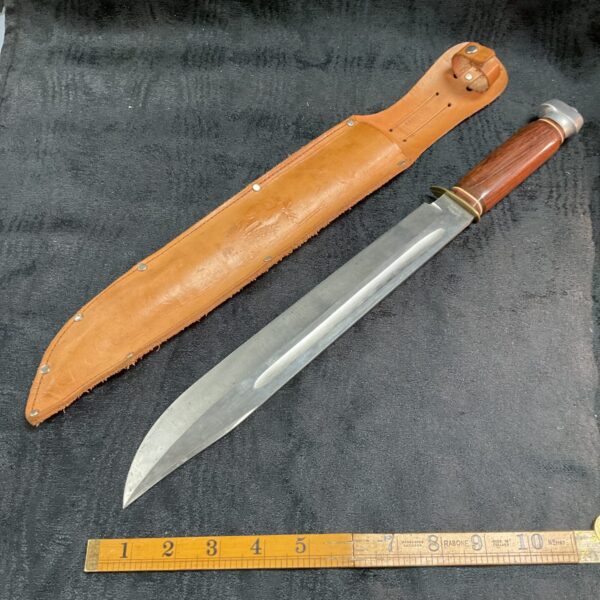 Vintage German Solingen Bowie knife with leather sheath.