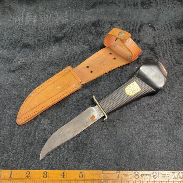 Vintage Solingen hunting knife with telescope and leather sheath.