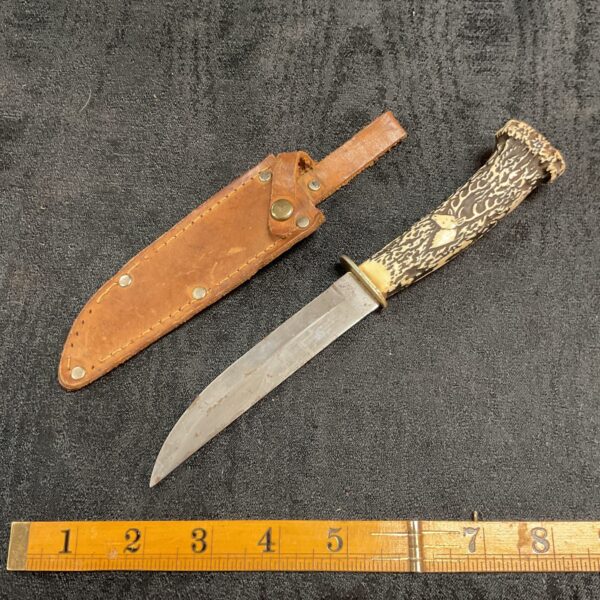 Vintage Solingen Germany knife with stag horn handle and leather sheath.